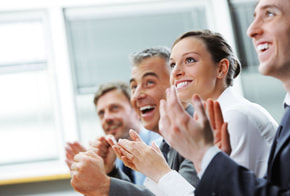 business people laughing smiling clapping at speaker Picture
