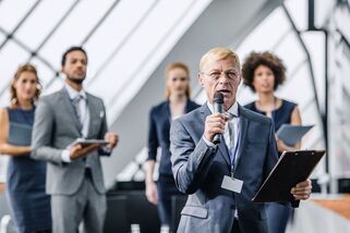 Business people man speaking with microphone in hand Picture