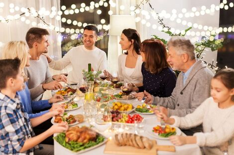 Celebration of Life family gathering at dinner table remembering loved one with smiles Picture