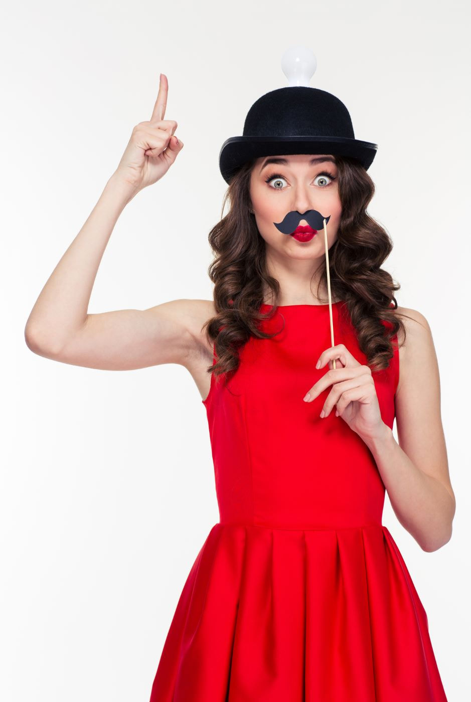 Memorable woman in red dress and photo booth props making funny face Picture