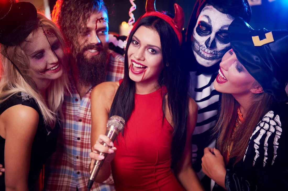 Halloween costumes woman singing into mic Picture