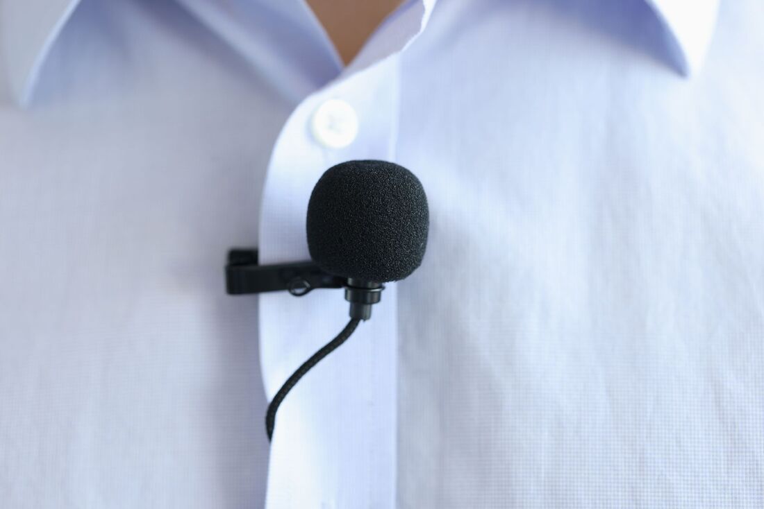 Lapel mic on a blue button down shirt Picture
