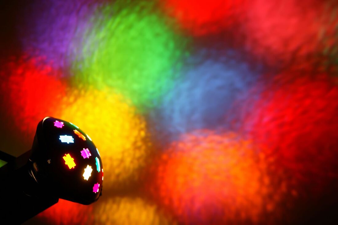 Vertigo DJ light shining colorful lights at wall Picture